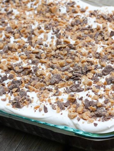 A doctored up cake mix and other store bought ingredients makes this Heath Bar Cake super easy to make and a complete hit every time!
