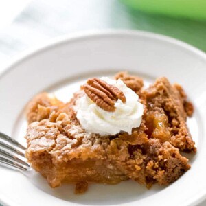 This apple dump cake is the easiest dump cake recipe, with three basic ingredients. If you are looking for an easy fall dessert, this recipe is just that. Tender bits of apple in every bite covered with a spiced cake that is delicious, down to the last bite. An easy apple dessert you can whip up any time of day. #apple #dessert #dumpcake #falldessert #appledessert #easydesserts| allthingsmamma.com