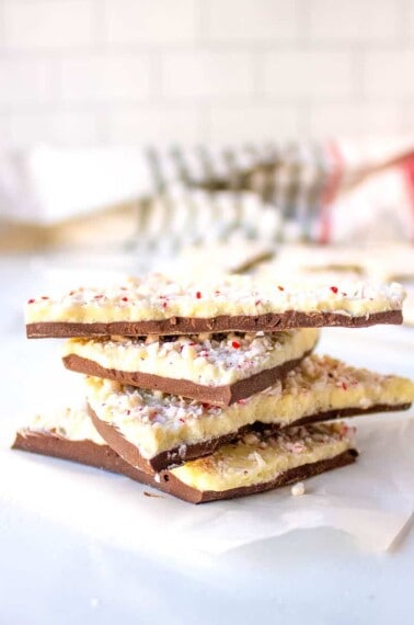 Four pieces of peppermint bark stacked on top of each other.