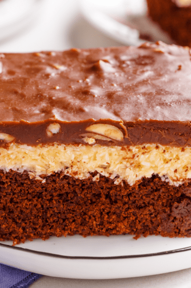 A slice of Almond Joy cake on a plate.