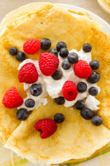 crepes with fresh berries and whipped cream.