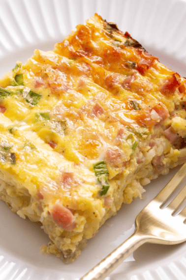 A slice of farmer's breakfast casserole on a plate.