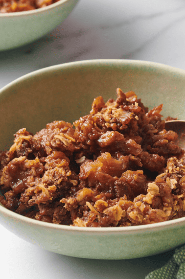 A bowl of slow cooker apple crisp.