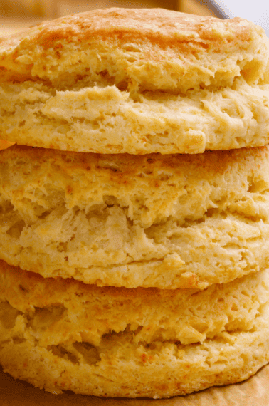 Three homemade Popeyes biscuits on top of each other.