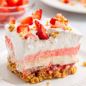 A slice of strawberry delight on a plate.