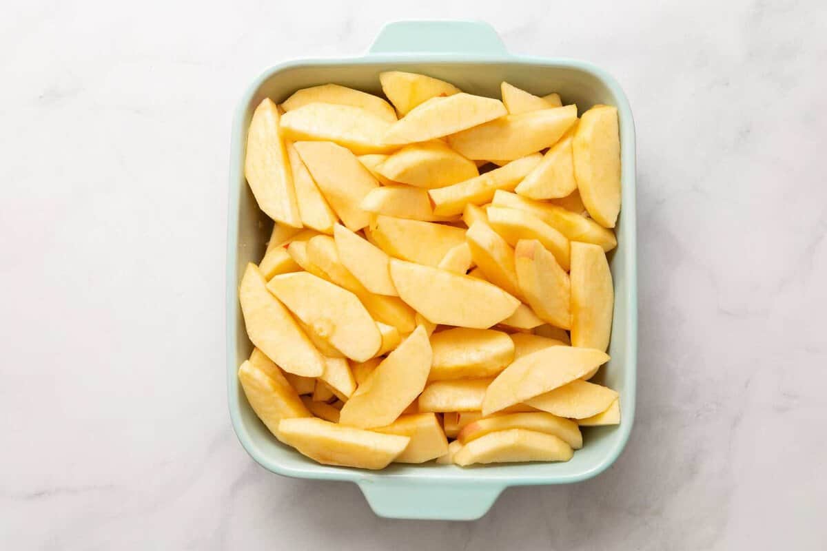 apples peeled in a dish for apple crisp