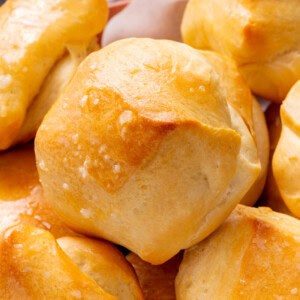 close up of buttered parker house rolls.