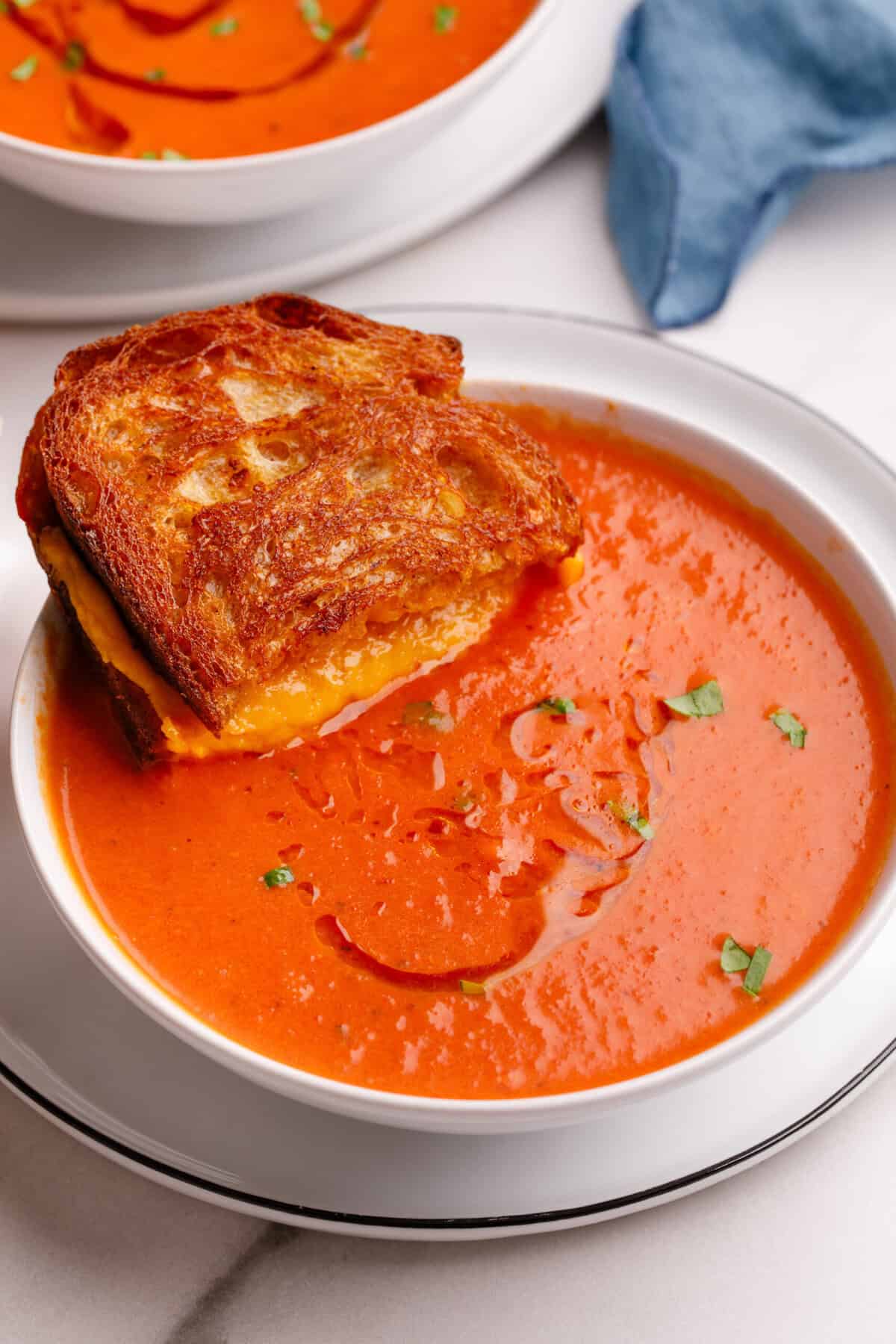 Grilled Cheese Sandwich A Grilled Cheese Sandwich sitting in a bowl of soup.