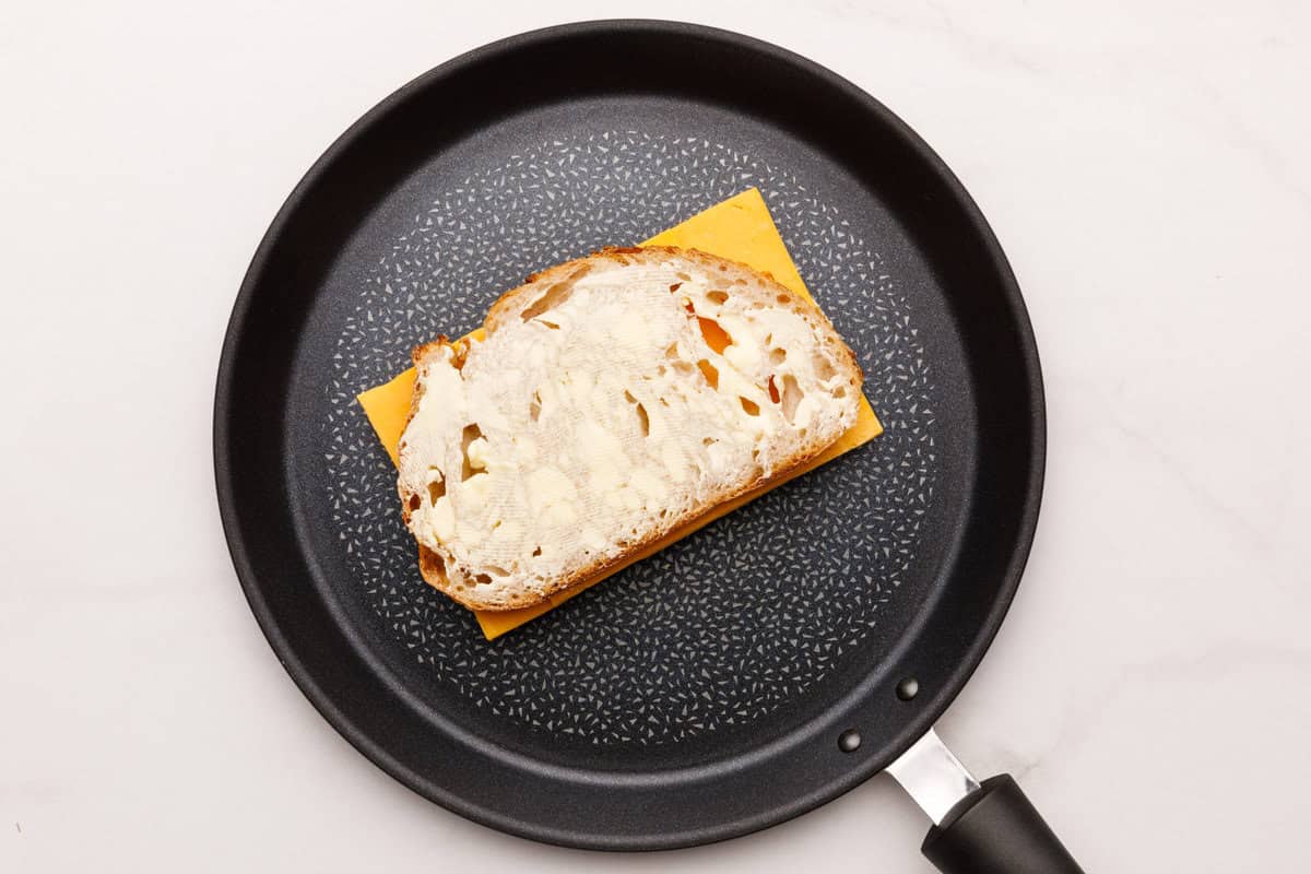 Grilled Cheese Sandwich A piece of bread on top of cheese for a Grilled Cheese Sandwich.