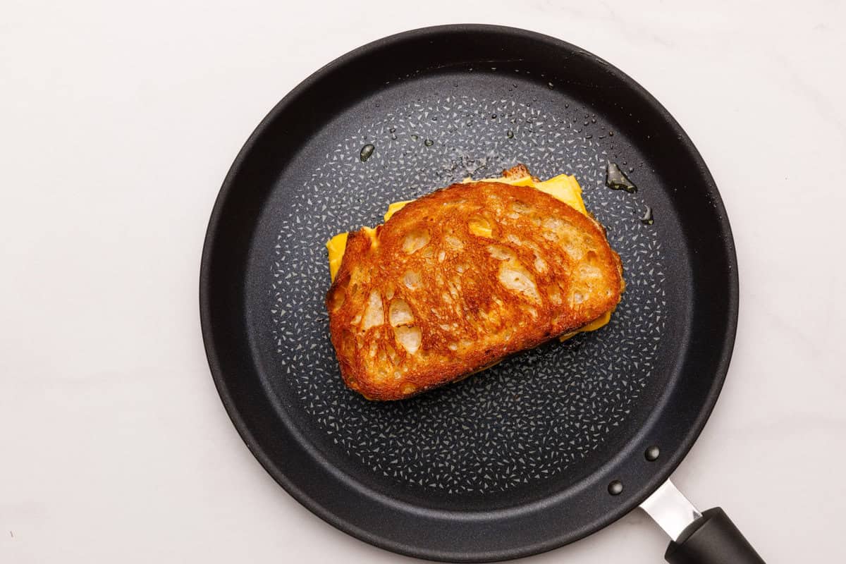 Grilled Cheese Sandwich A Grilled Cheese Sandwich cooking a hot pan.