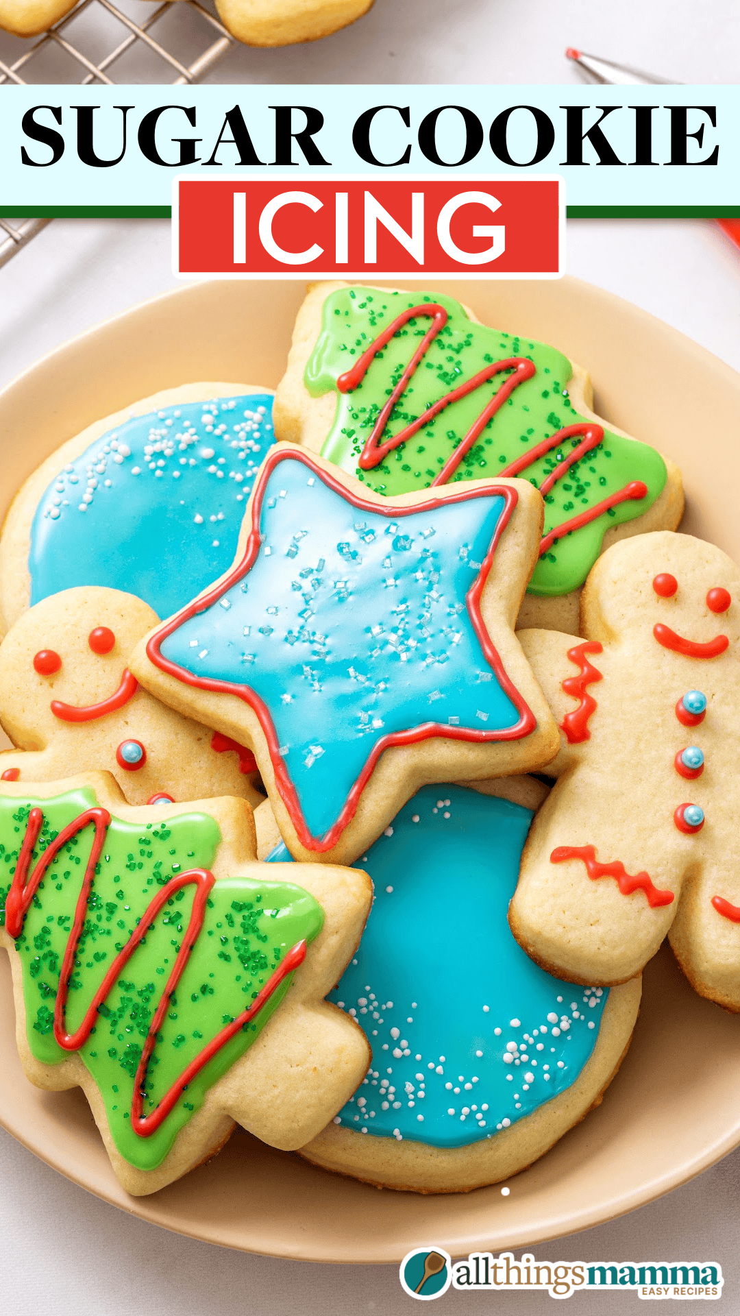 Sugar Cookie Icing A plate of festive sugar cookies decorated with colorful icing and sprinkles, including Christmas trees, stars, and gingerbread men.