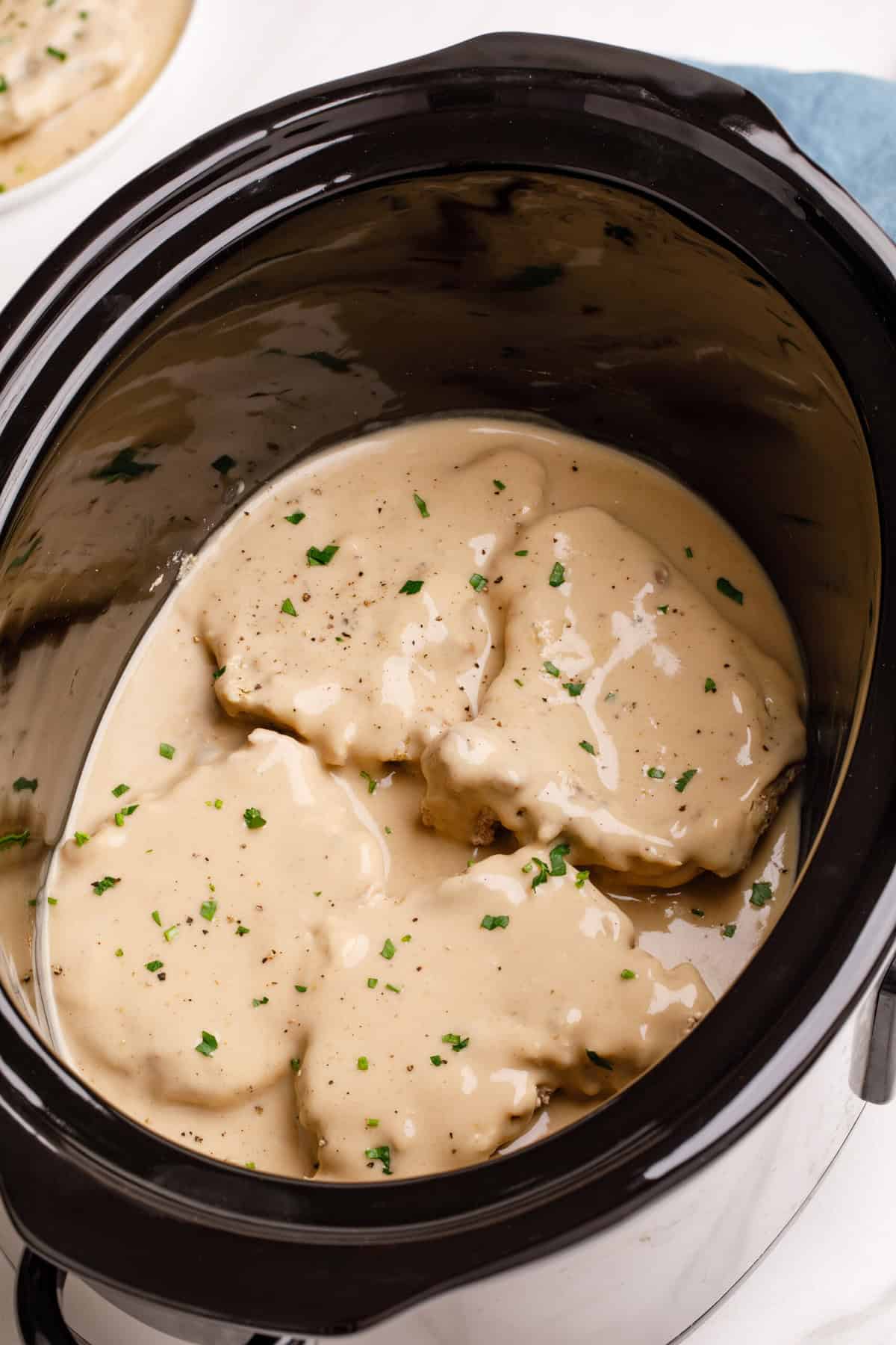 Crockpot pork chops in a slow cooker pork chops cooked in a slow cooker.