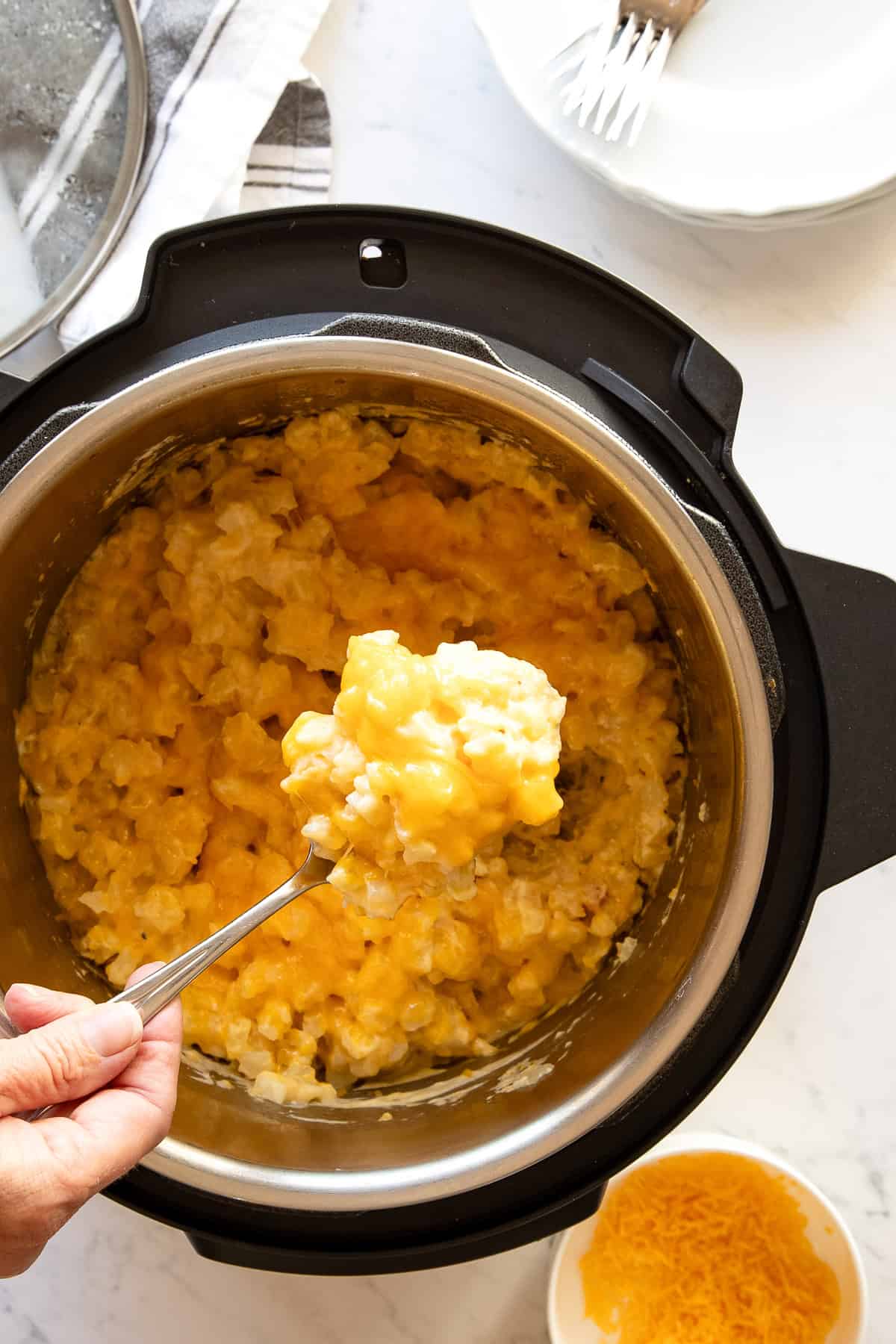 crockpot cheesy potatoes being served