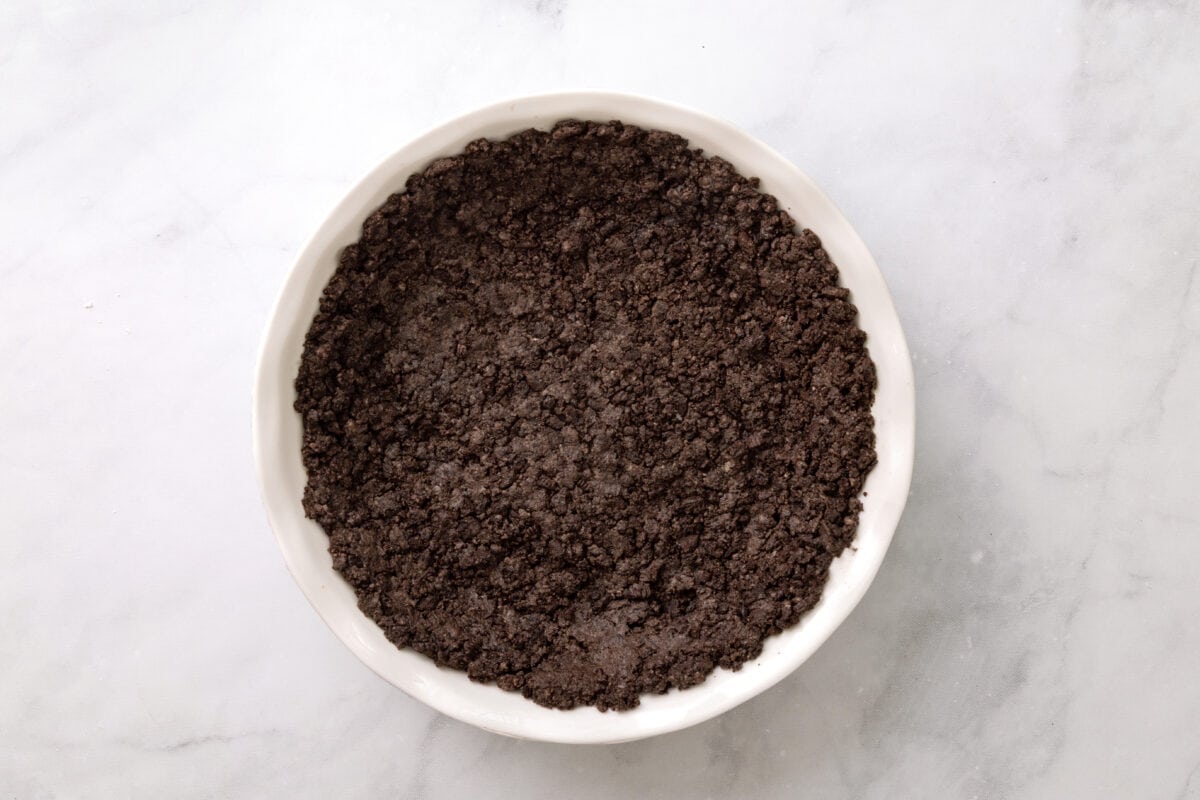oreo crust in a white pie plate