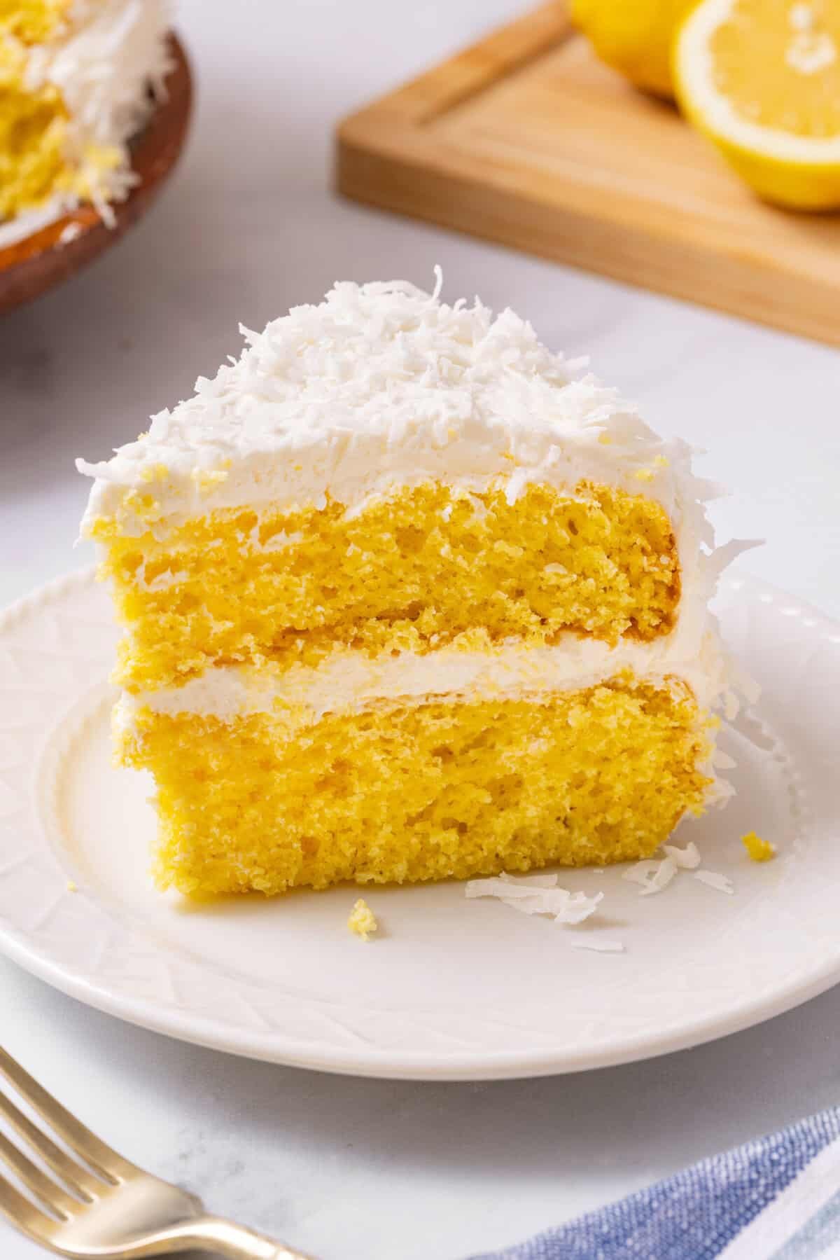 Lemon coconut cake slice Lemon coconut cake with shredded coconut.