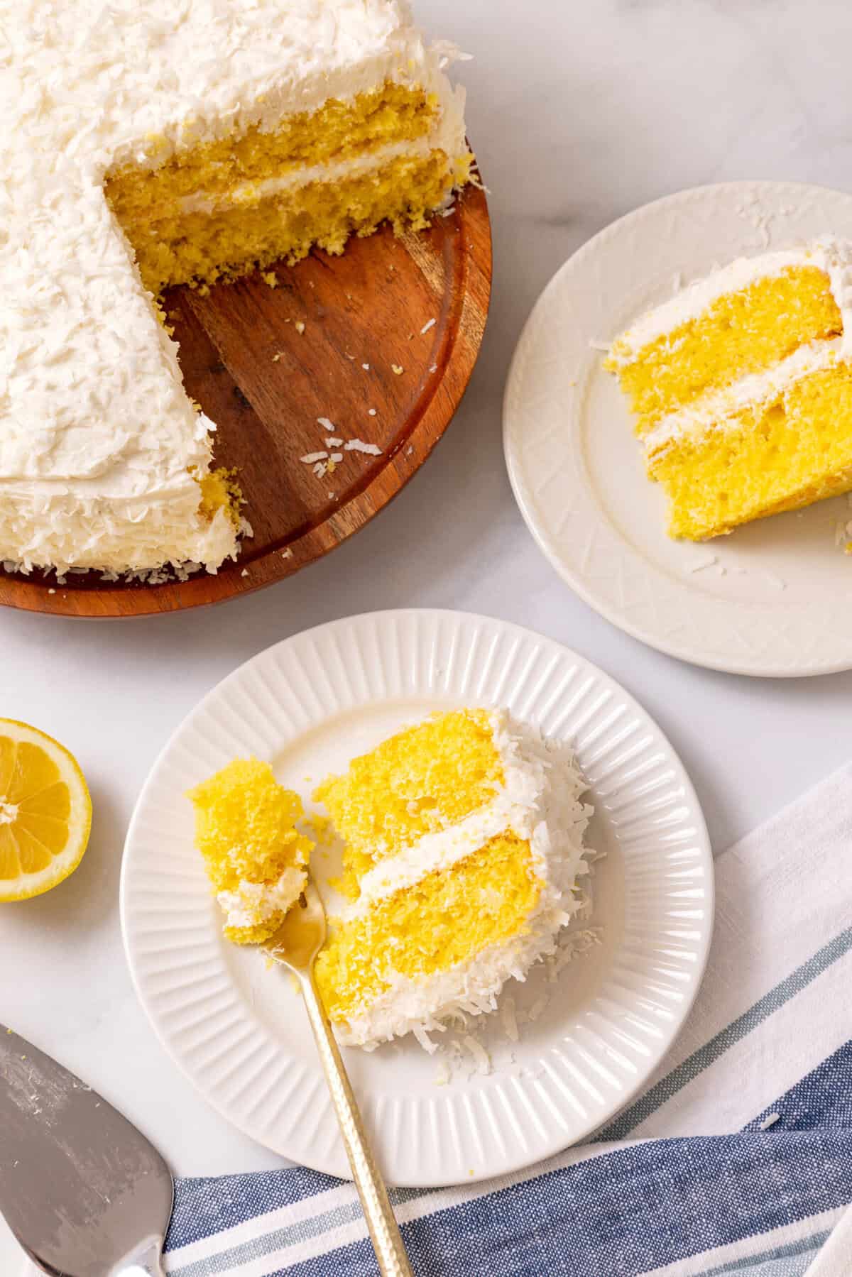 slices of lemon coconut cake Lemon coconut cake slice on a white plate.