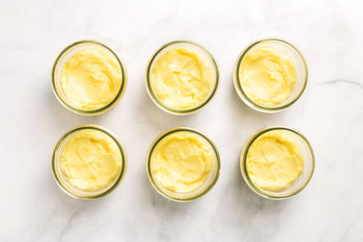 Overhead view of coconut cream pie parfaits in jars